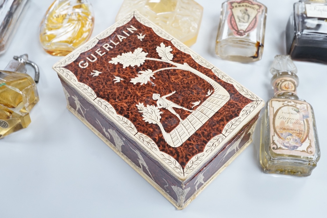 A Baccarat Guerlain perfume bottle in original box and a collection of other empty perfume bottles